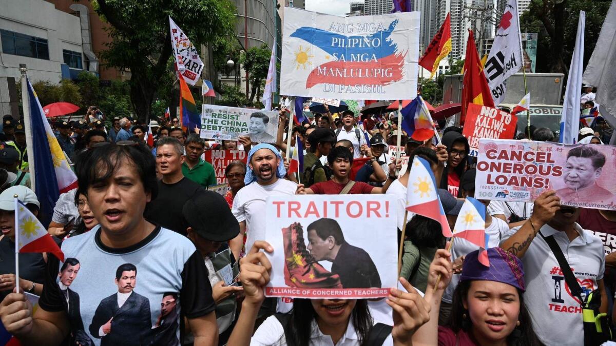 Protesters descend on the Chinese Embassy in Manila on April 9, 2019, to oppose the Asian superpower's growing sway in the Philippines as tensions rise over Beijing's presence in the disputed South China Sea.