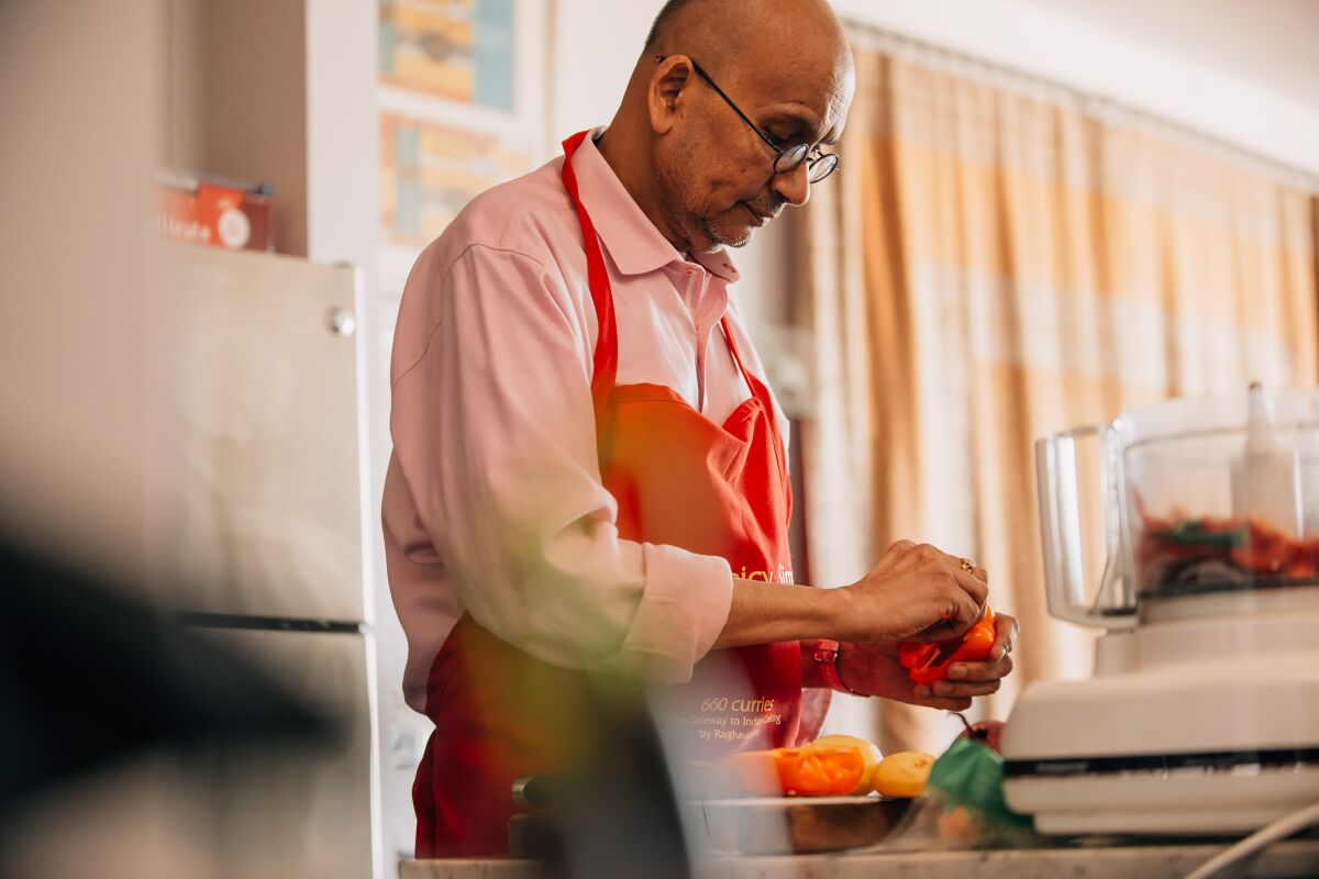 Raghavan Iyer prepares a lunch of vegetable rice and kidney beans at his home in Minneapolis.