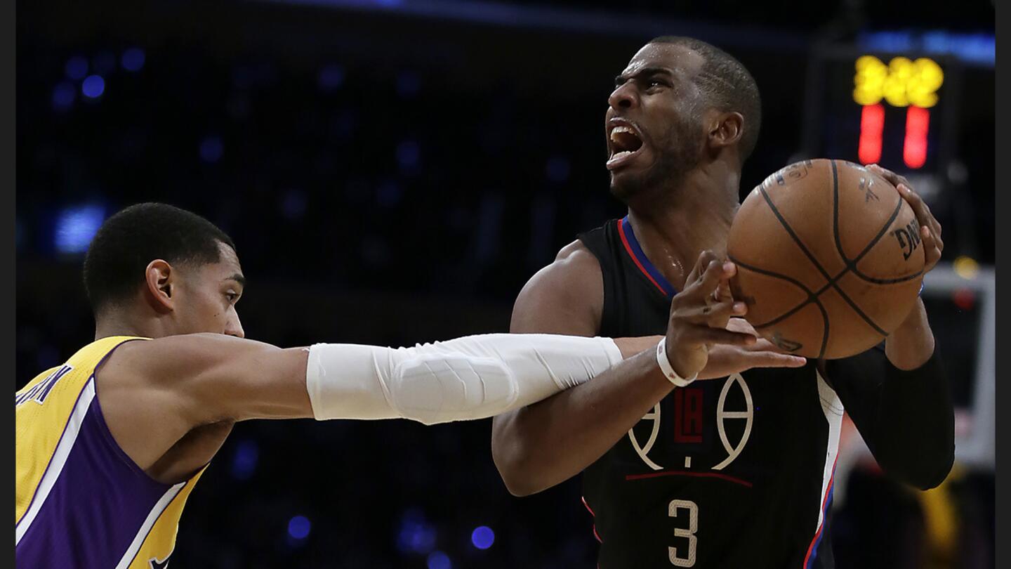 Clippers guard Chris Paul screams out as he is fouled by Lakers guard Jordan Clarkson during second half action at Staples Center.