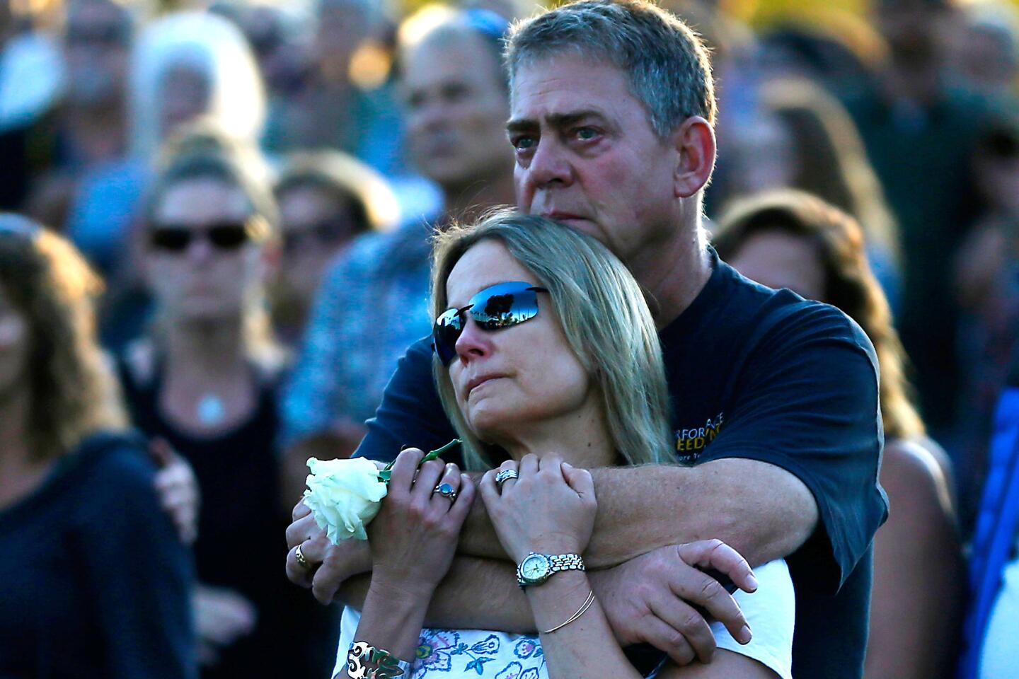 Mourners gather for a vigil at Chase Palm Park in Santa Barbara on Friday evening honoring the victims of the Conception boat fire that broke out off Santa Cruz Island before dawn Monday and claimed 34 lives.