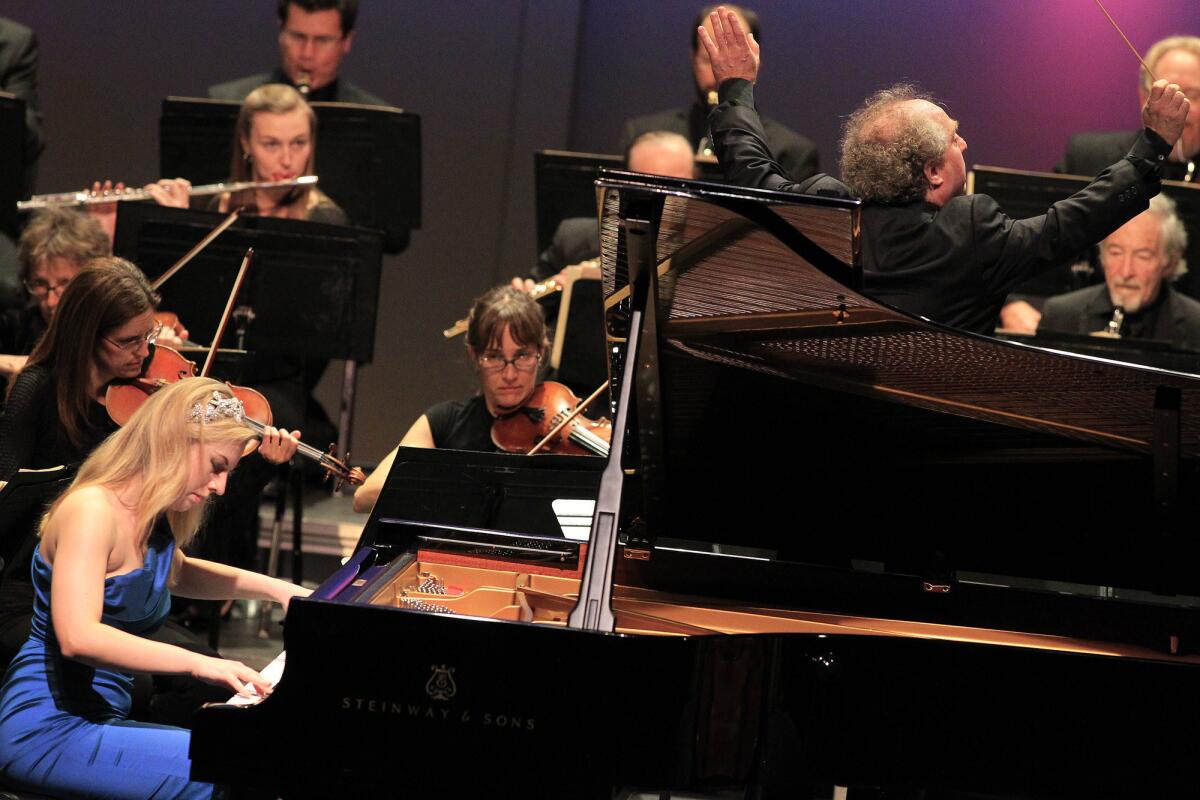 Conductor Jeffrey Kahane, top right, leads the Los Angeles Chamber Orchestra in Chopin's Piano Concerto No. 2 featuring pianist Natasha Paremski, left, at the Alex Theatre in Glendale.