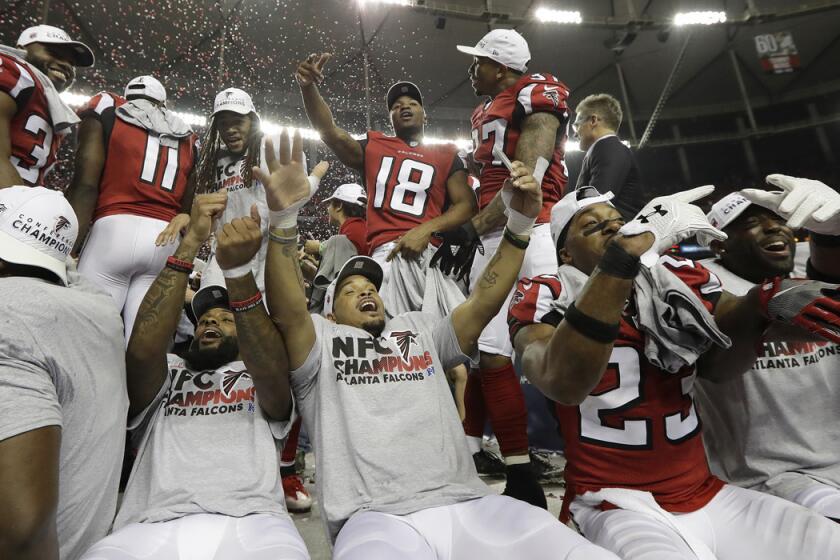 Atlanta Falcons players whoop it up Sunday after defeating the Green Bay Packers in the NFC championship game.