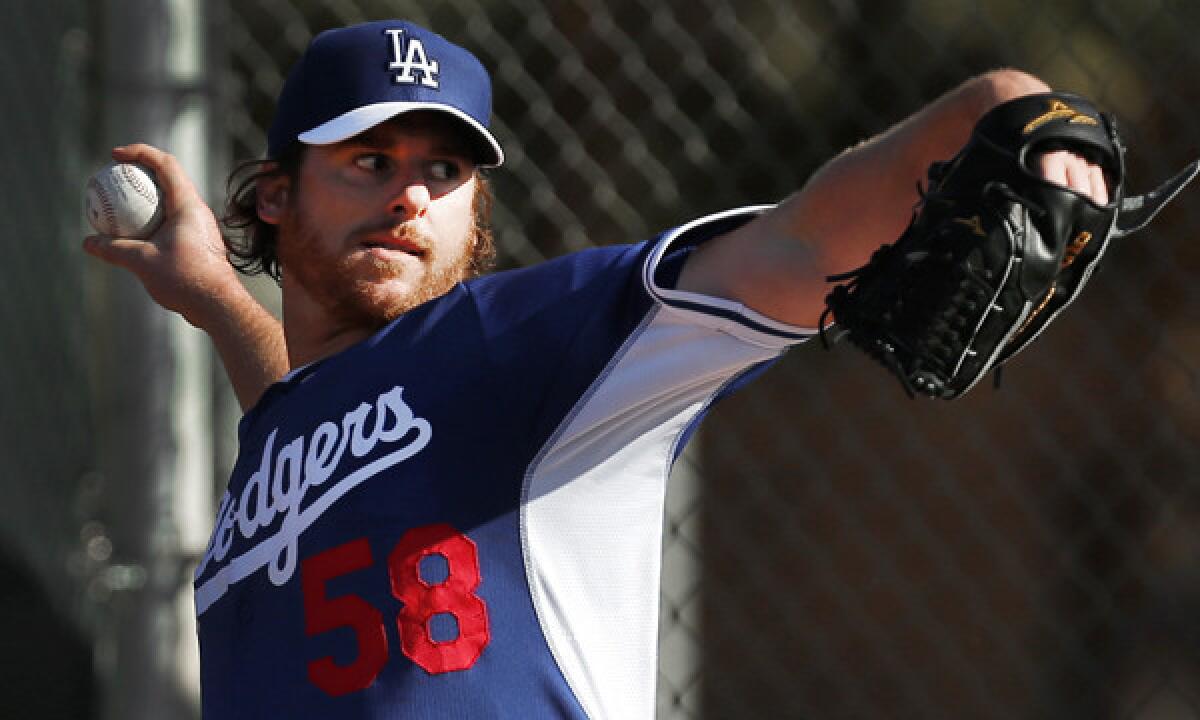 Dodgers pitcher Chad Billingsley throws during a spring training practice session on Feb. 10. Billingsley begins his minor-league rehabilitation assignment on Sunday.