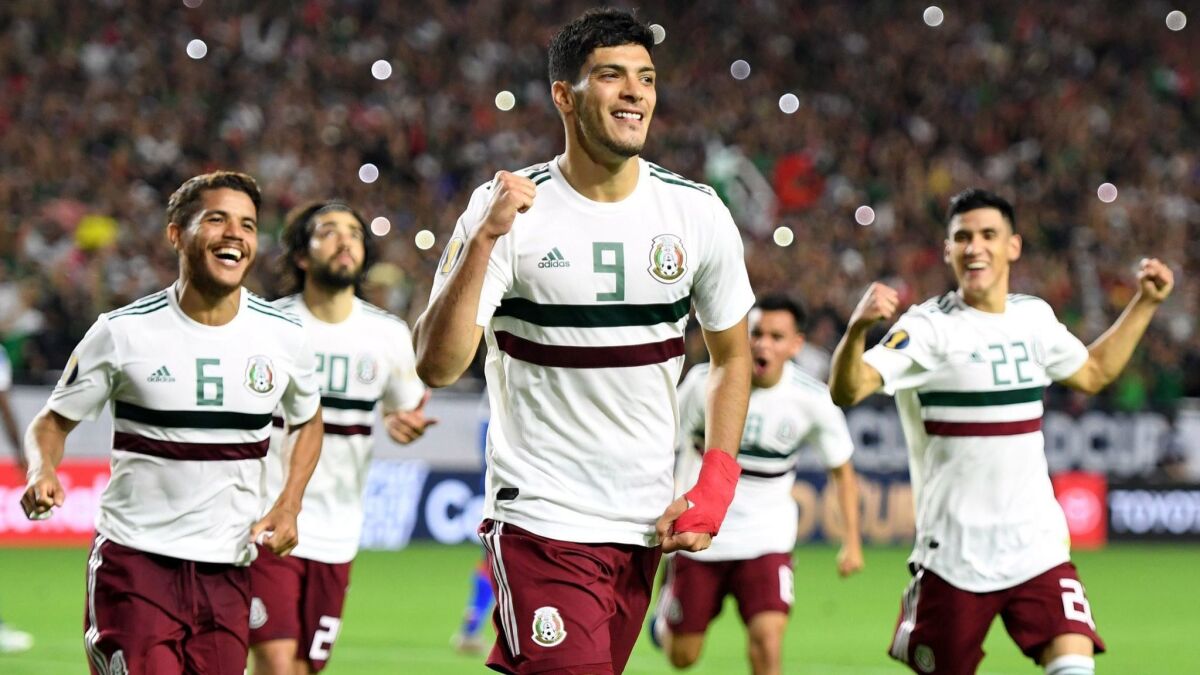Mexico's forward Raul Jimenez (9) celebrates with teammates after scoring a goal in overtime during the Gold Cup semifinal match between Mexico and Haiti on Tuesday in Glendale, Ariz.