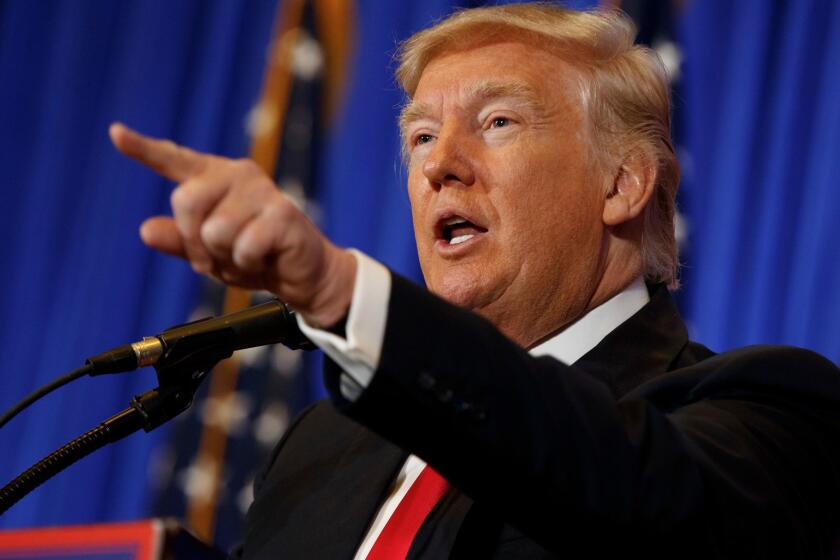 President-elect Donald Trump speaks during a news conference in the lobby of Trump Tower in New York on Jan. 11.