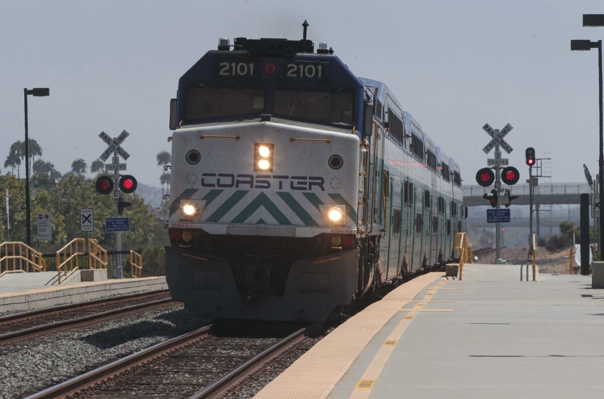 A northbound Coaster train arrives at the Poinsettia station in Carlsbad.