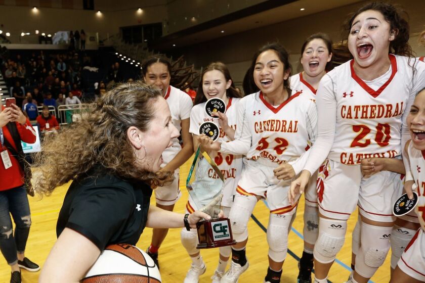 SAN DIEGO, February 23rd, 2019 | Cathedral Catholic vs Mission Hills in the San Diego Section Open Division girls basketball championship on Saturday, February 23rd, 2019 at UCSD's RIMAC Arena. Cathedral Catholic players celebrate their victory over Mission Hills in the Open Division final with coach Jackie Turpin (left). Photo by Chadd Cady