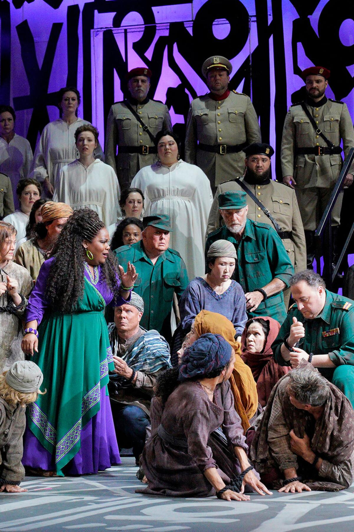 Performers sing on stage