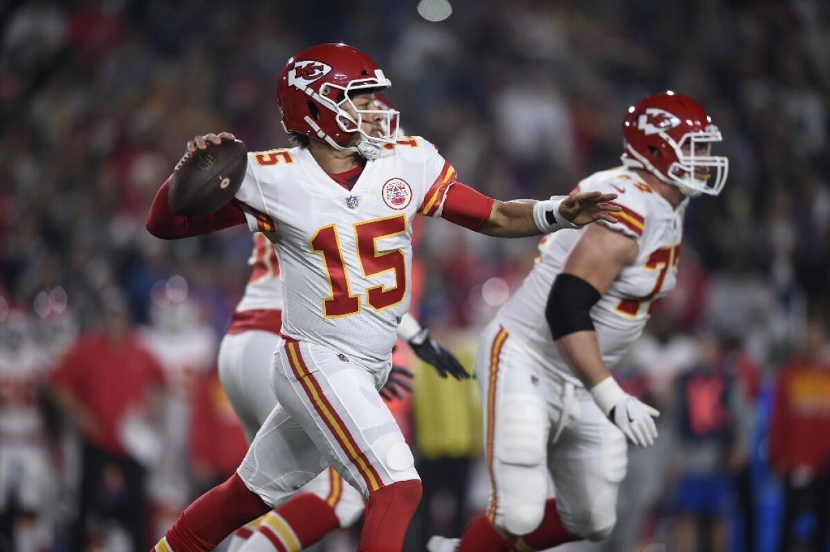 Chiefs quarterback Patrick Mahomes (15) passes against the Rams on Nov. 19.