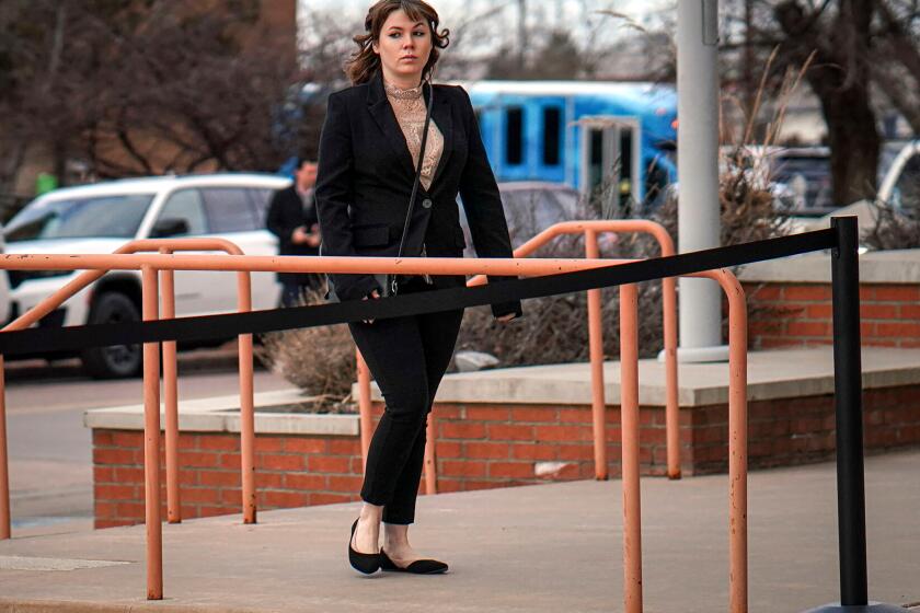 Hannah Gutierrez-Reed arrives at the First Judicial District Courthouse in Santa Fe, N.M., on Wednesday, Feb. 21, 2024, for the start of her trial on charges of involuntary manslaughter and tampering with evidence.