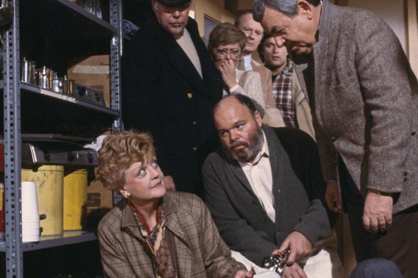 LOS ANGELES - MARCH 17: (Pictured left to right) Don Stroud (as Carey Drayson, on ground) Angela Lansbury (as mystery writer Jessica Fletcher), Albert Salmi (as Joe Downing), Mills Watson (as Ralph Leary, kneeling), Rue McClanahan (as Miriam Radford), Larry Linville (as Prof. Kent Radford), Terence Knox (as Steve Pascal) and Tom Bosley (as Sheriff Amos Tupperstar) star in an episode of the CBS television detective drama "Murder, She Wrote titled "Murder Takes the Bus". The episode originally aired March 17, 1985. (Photo by CBS via Getty Images)