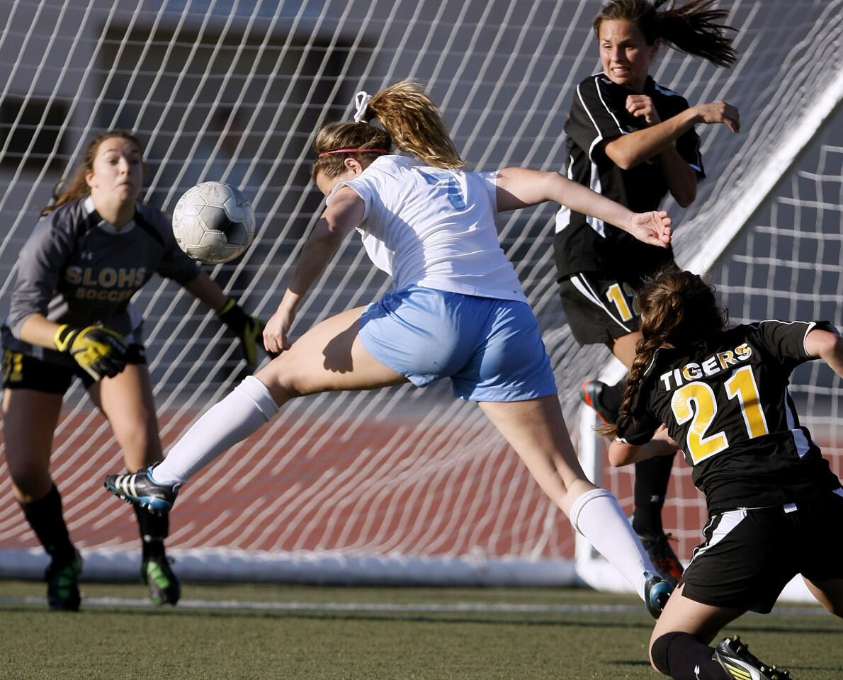 Crescenta Valley High's #7 Whitley Boller just misses a header in front of the goal during CIF SS Div. III first round girls' soccer playoff vs. San Luis Obispo High School at Crescenta Valley High School in La Crescenta on Thursday, February 14, 2013. CV won 1-0.