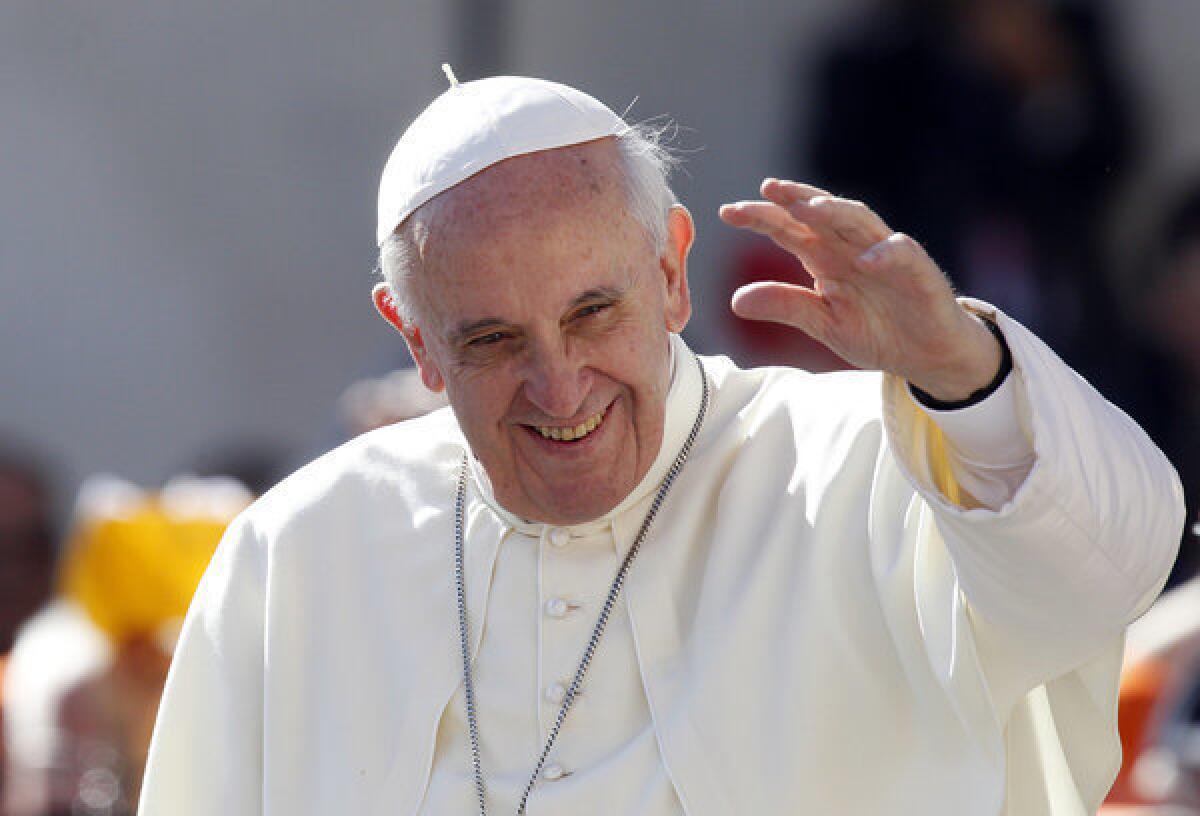 Pope Francis waves to the faithful in St. Peter's Square at the Vatican on Wednesday. He said in an interview, "We cannot insist only on issues related to abortion, gay marriage and the use of contraceptive methods."