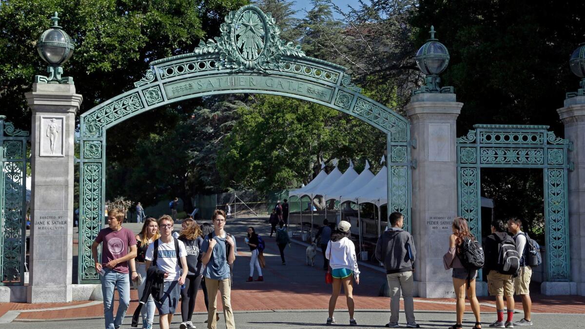Students walk past Sather Gate on the University of California, Berkeley campus in Berkeley, Calif. on April 21.