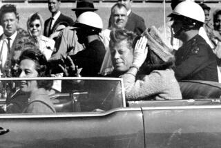FILE - In this Nov. 22, 1963 file photo, President John F. Kennedy waves from his car in a motorcade approximately one minute before he was shot in Dallas. Riding with Kennedy are First Lady Jacqueline Kennedy, right, Nellie Connally, second from left, and her husband, Texas Gov. John Connally, far left. The National Archives has until Oct. 26, 2017, to disclose the remaining files related to Kennedy's assassination, unless President Donald Trump intervenes. (AP Photo/Jim Altgens, File)