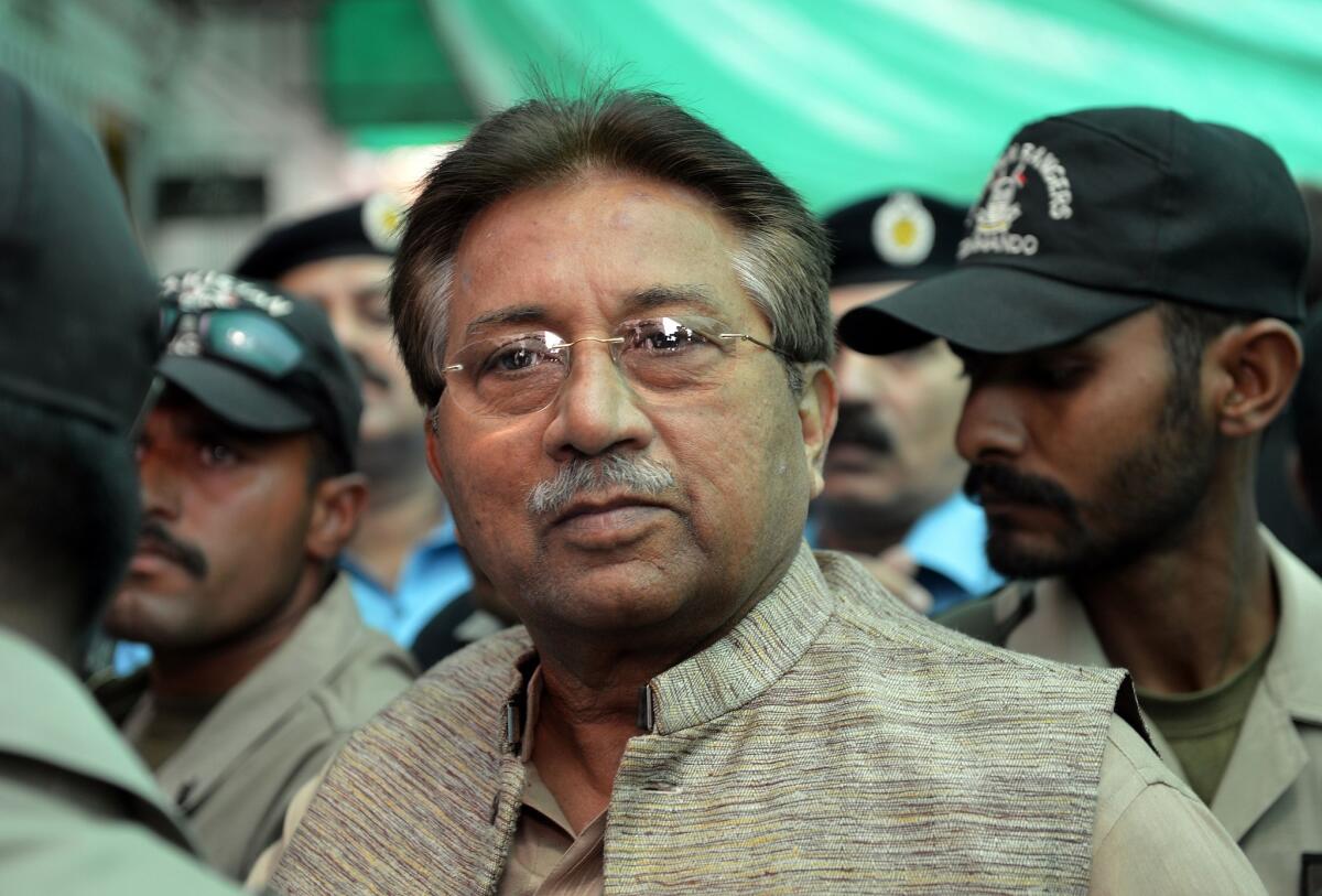 Former Pakistani President Pervez Musharraf is escorted by soldiers at an Islamabad court in April.