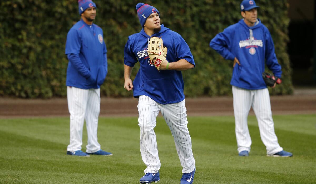 Chicago Cubs' Kyle Schwarber works out in the outfield during batting practice at Wrigley Field on Thursday.