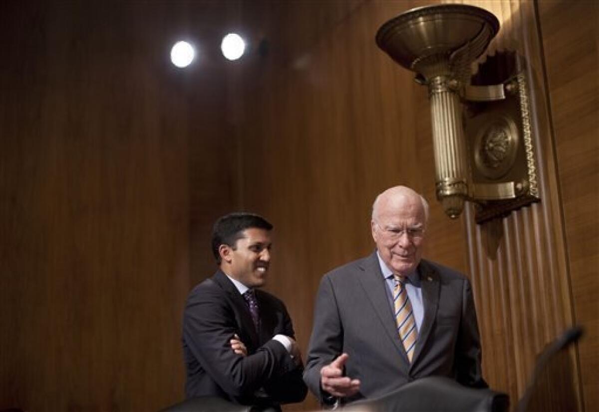 Sen. Patrick J. Leahy (D-Vt.), right, talks with U.S. Agency for International Development Administrator Rajiv Shah after a hearing at which lawmakers questioned a USAID program in Cuba.