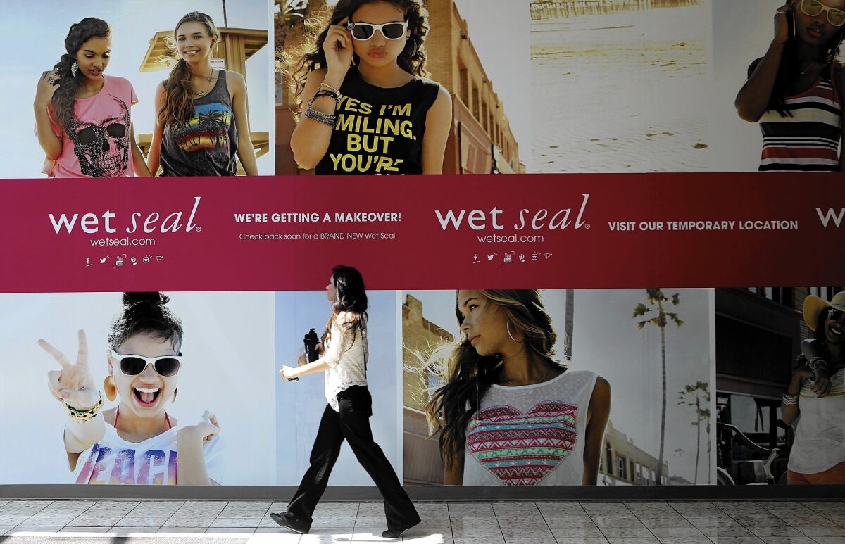 Analysts say Wet Seal may be heading for bankruptcy unless it can dramatically overhaul its brand and perhaps find a buyer. Above, Shianne Penoli walks past the future location of a Wet Seal at the Mt. Shasta Mall in Redding, Calif., in 2013.