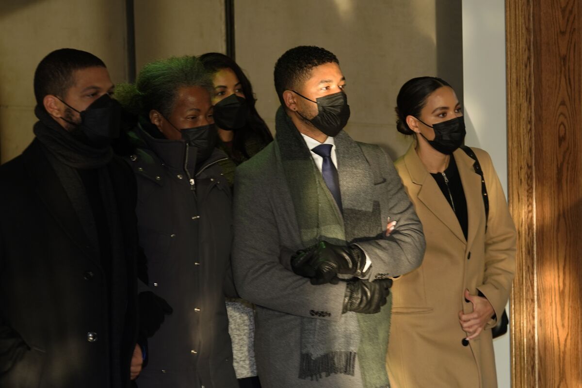 Actor Jussie Smollett, second from right, departs the Leighton Criminal Courthouse Wednesday, Dec. 8, 2021, with his mother, Janet, center, and unidentified siblings after Cook County Judge James Linn gave the case to the jury in Chicago. (AP Photo/Charles Rex Arbogast)