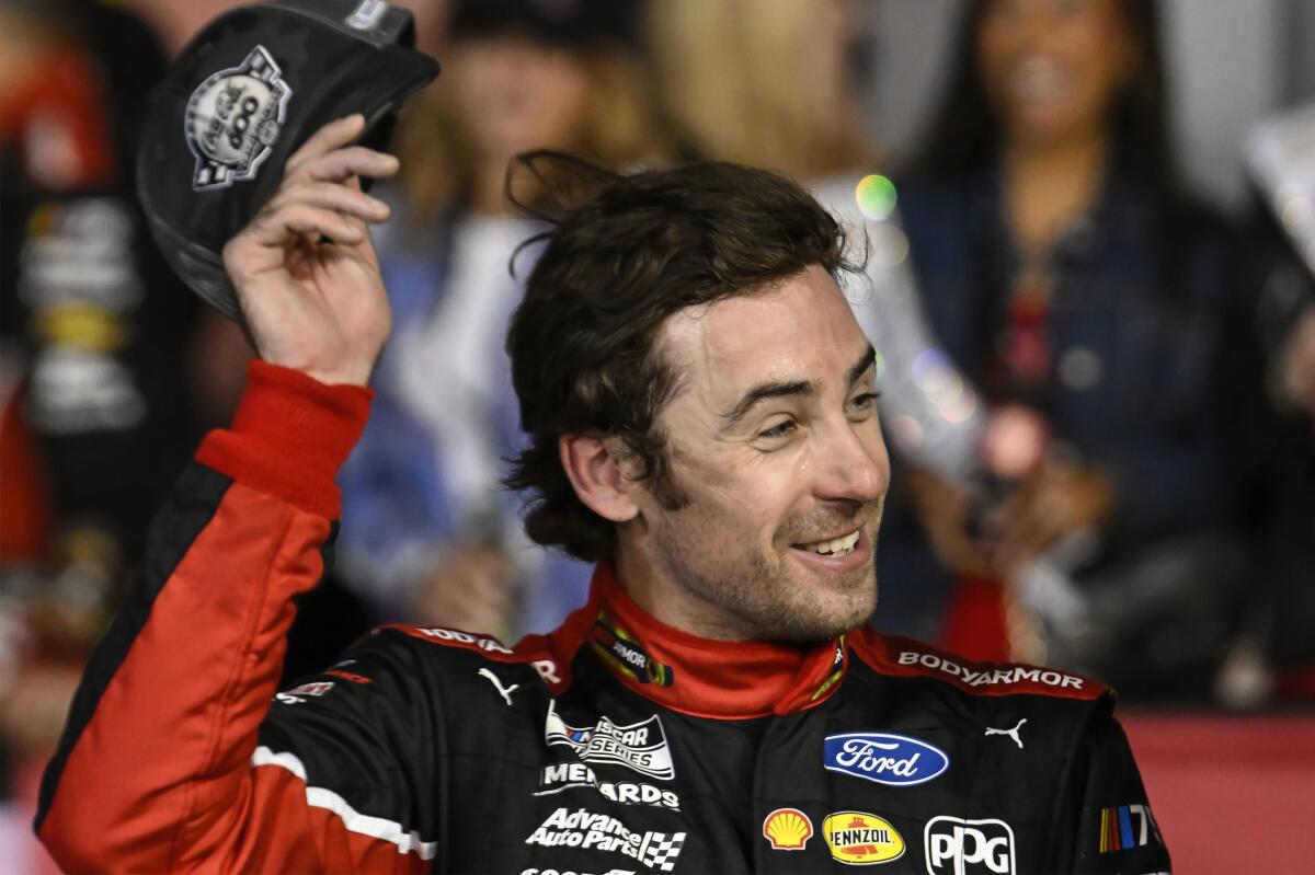 Ryan Blaney celebrates after winning the NASCAR Cup Coca-Cola 600 at Charlotte Motor Speedway.