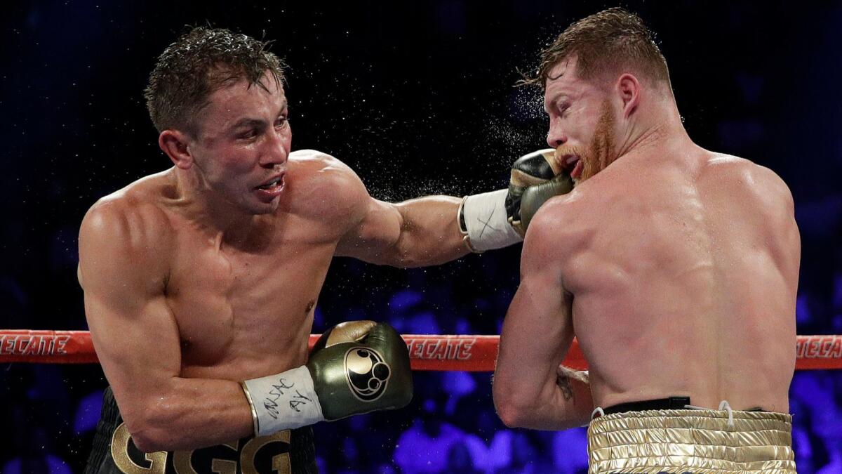 Gennady Golovkin, left, connects with a left to Canelo Alvarez during their middleweight title fight Sept. 17, 2017, in Las Vegas.