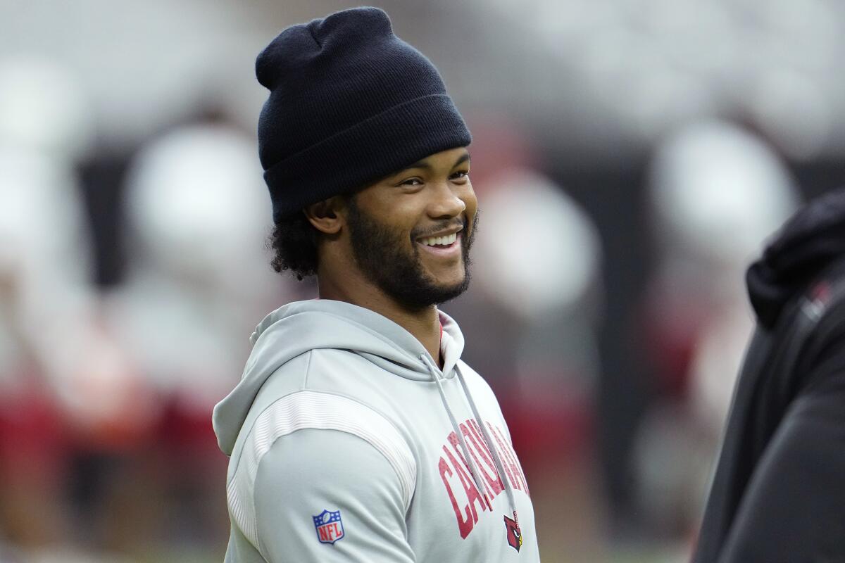 Oklahoma quarterback Kyler Murray holds his up a jersey after the