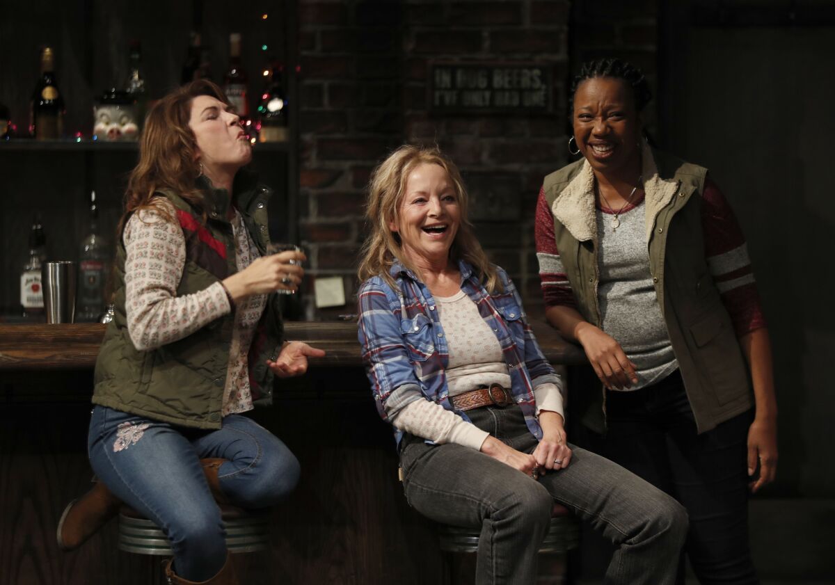 Amy Pietz, left, is Jessie, Mary Mara is Tracey, and Portia is Cynthia in "Sweat," Lynn Nottage's Pulitzer Prize-winning drama about a factory town in Pennsylvania, playing at the Mark Taper Forum in Los Angeles.