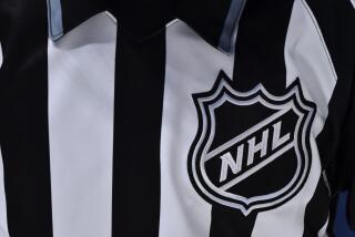 NHL logo on a referee's uniform.