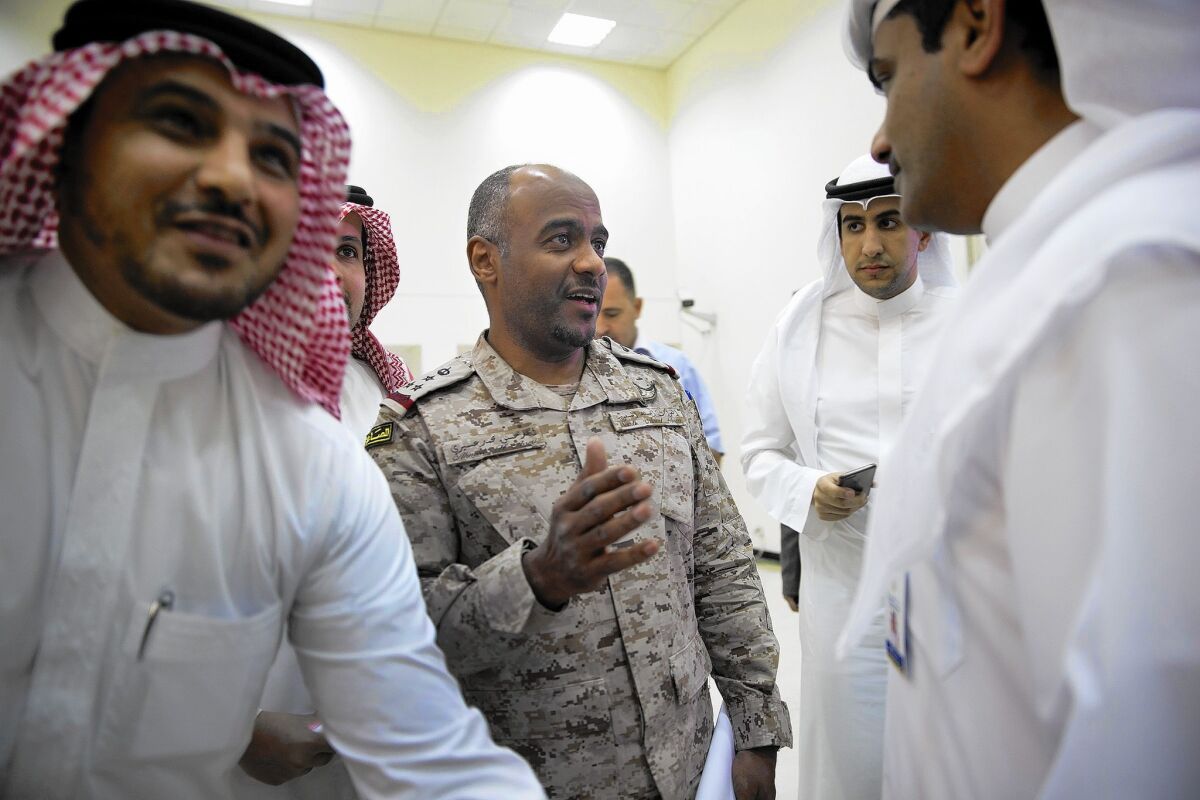 Brig. Gen. Ahmed Asiri, center, spokesman for the Saudi-led Arab coalition coordinating airstrikes in Yemen, speaks to reporters about operations against Houthi rebels.