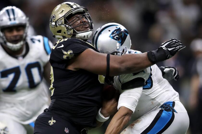 NEW ORLEANS, LA - JANUARY 07: David Onyemata #93 of the New Orleans Saints tackles Cam Newton #1 of the Carolina Panthers at the Mercedes-Benz Superdome on January 7, 2018 in New Orleans, Louisiana. (Photo by Chris Graythen/Getty Images) ** OUTS - ELSENT, FPG, CM - OUTS * NM, PH, VA if sourced by CT, LA or MoD **