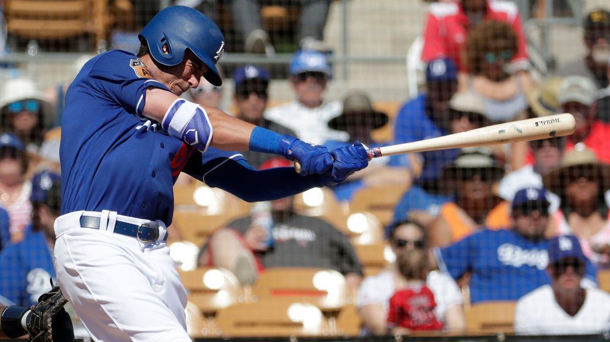 Dodgers' Cody Bellinger hits against the Angels during the second inning of a spring training game on March 11 in Phoenix.