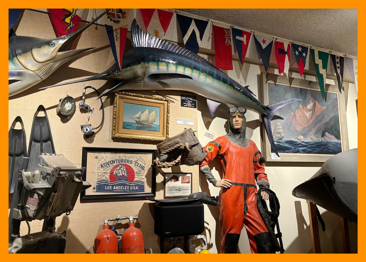 Various sailing and ocean related objects hang from the walls at The Adventurer's Club.