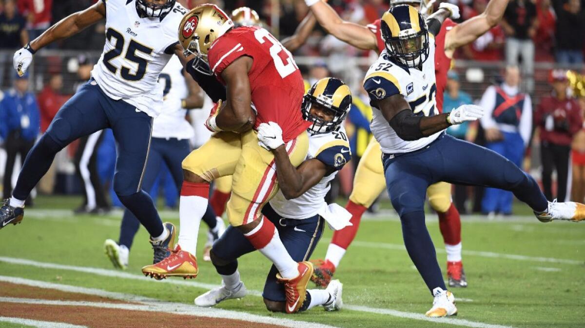 San Francisco running back Carlos Hyde rushes for a touchdown against the Rams during a game in Santa Clara, Calif., on Sept. 12.
