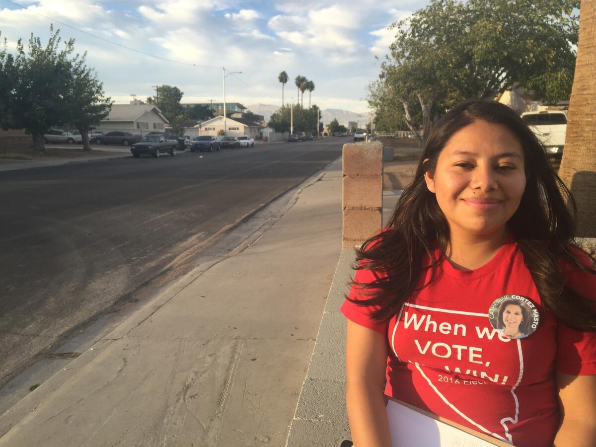 Immigrant Miriam Cadenas, 19, encourages Latino voters to go to the polls in Las Vegas.