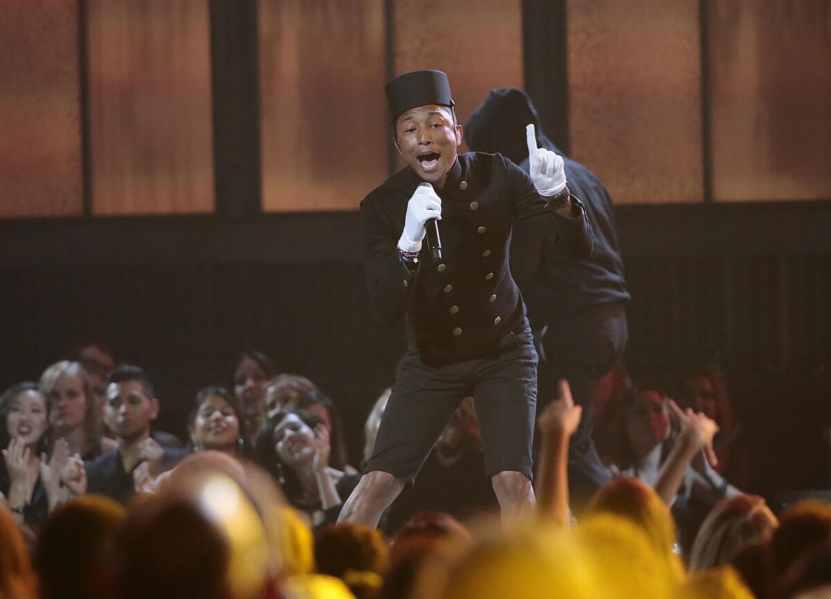 Pharrell Williams performs during the 57th Grammy Awards ceremony.