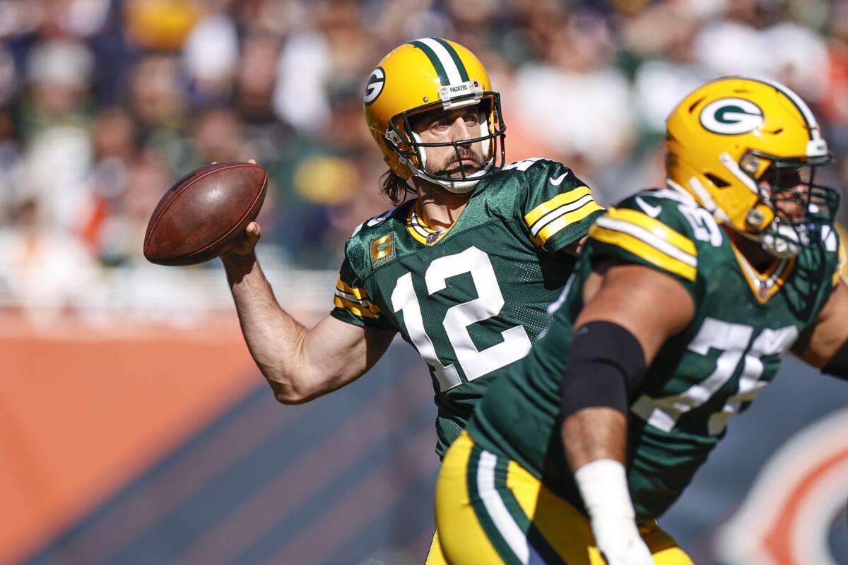 Green Bay Packers quarterback Aaron Rodgers looks to pass against the Chicago Bears.