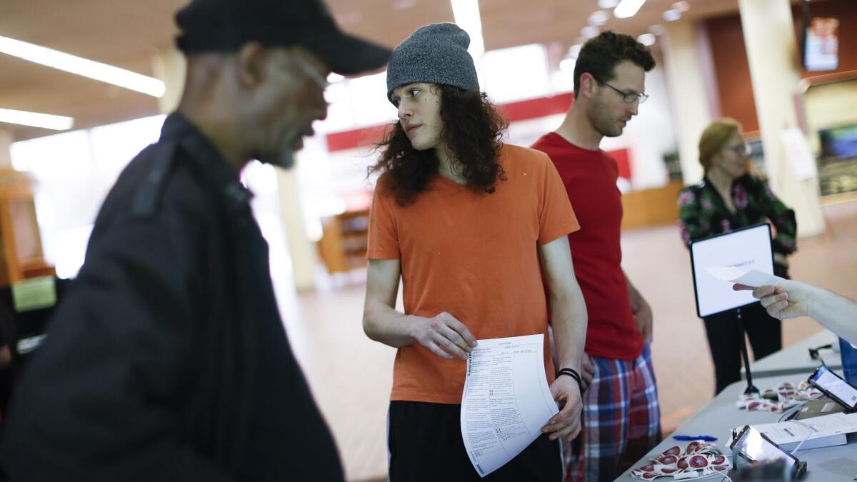 A voter checks in before filling out a ballot in Cincinnati, Ohio.