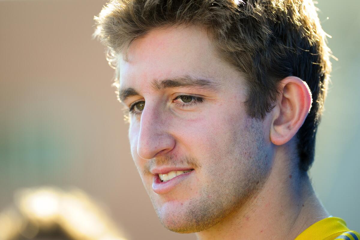 Quarterback Josh Rosen talks with reporters following the opening day at UCLA spring football practice.