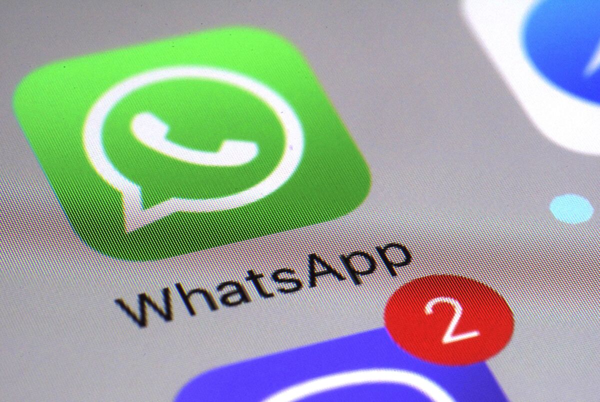 FILE - This March 10, 2017 file photo shows the WhatsApp communications app on a smartphone, in New York. Ireland's privacy watchdog said Thursday Sept. 2, 2021, it has fined WhatsApp a record 225 million euros ($267 million) after an investigation found it breached stringent European Union data protection rules on transparency about sharing people's data with other Facebook companies. (AP Photo/Patrick Sison, File)