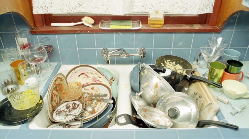 Sink full of dirty dishes