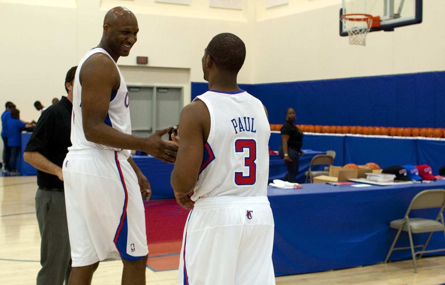 Newly acquired forward Lamar Odom greets point guard Chris Paul during media day at the Clippers' training facility in Playa Vista.