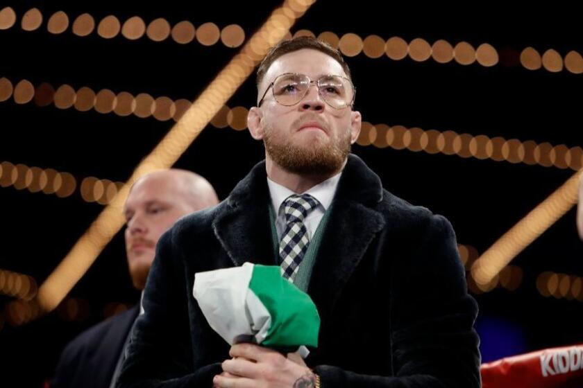Conor McGregor stands in the ring before a super-bantamweight boxing match between Michael Conlan and Tim Ibarra on St. Patrick's Day in New York.