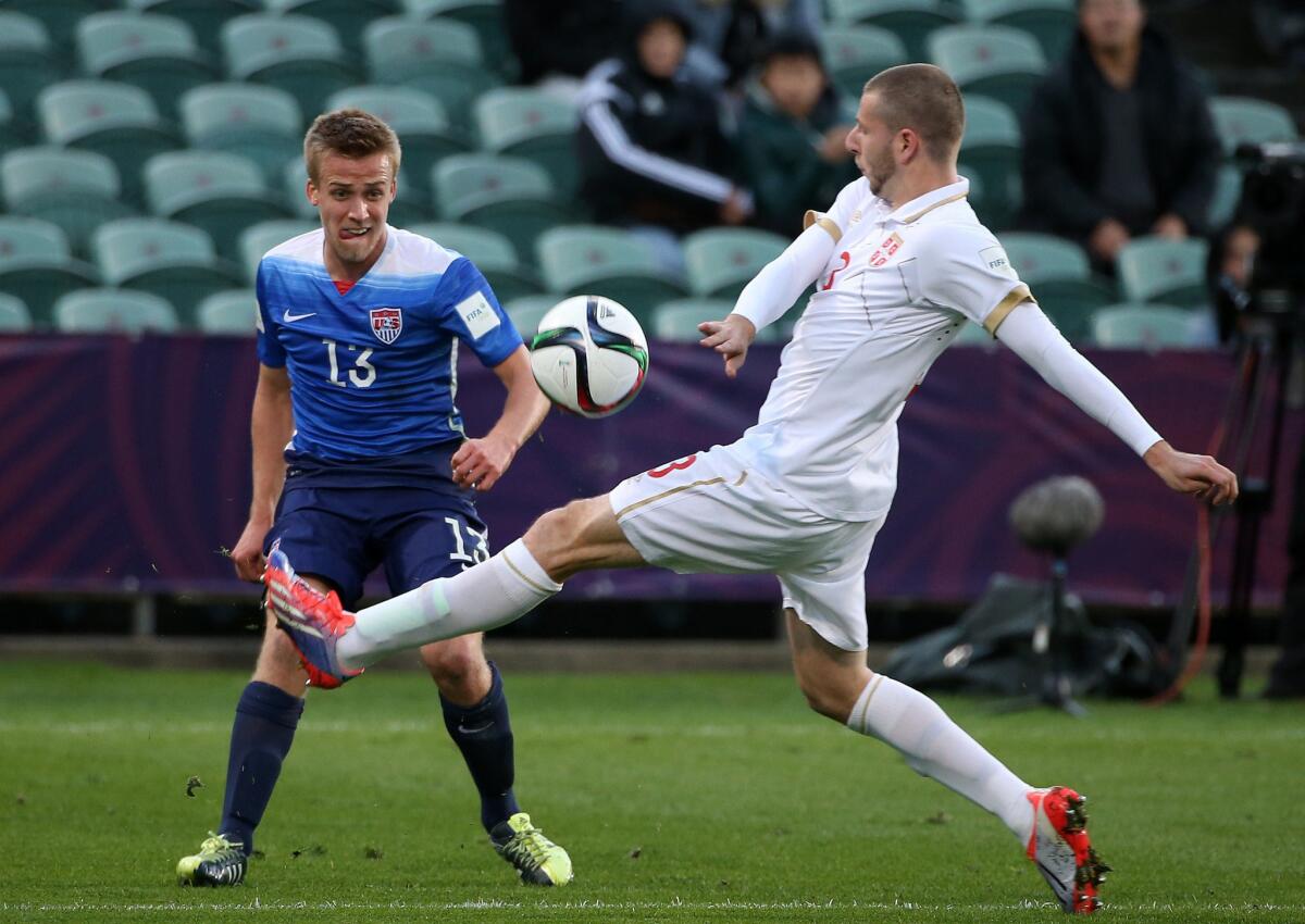 Thomas Thompson of the United States challenges Nemanja Antonov of Serbia during a quarterfinal match of the U-20 World Cup on Sunday in Auckland, New Zealand.