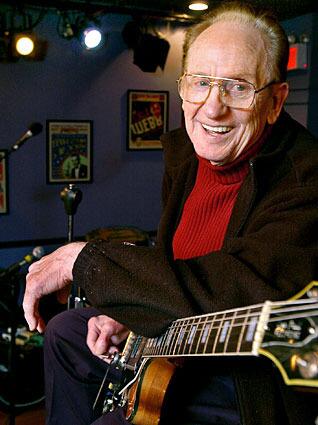FILE - In this Oct. 4, 2004 file photo, guitar legend Les Paul gets ready to rehearse at the Iridium Jazz Club in New York. Paul, 94, the guitarist and inventor who changed the course of music with the electric guitar and multitrack recording and had a string of hits, died, Thursday, Aug. 13, 2009 in White Plains, N.Y., according to Gibson Guitar. (AP Photo/Richard Drew, file)