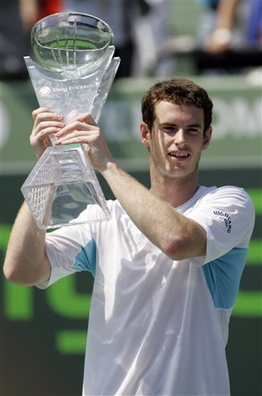 Andy Murray, from Britain, displays the winner's trophy after defeating Novak Djokovic, of Serbia, 6-2, 7-5 during their match at the Sony Ericsson Open tennis tournament in Key Biscayne, Fla. Sunday, April 5, 2009. (AP Photo/Alan Diaz)