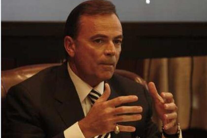 Commissioner Rick Caruso speaks at a meeting of the Los Angeles Memorial Coliseum Commission in December 2010.