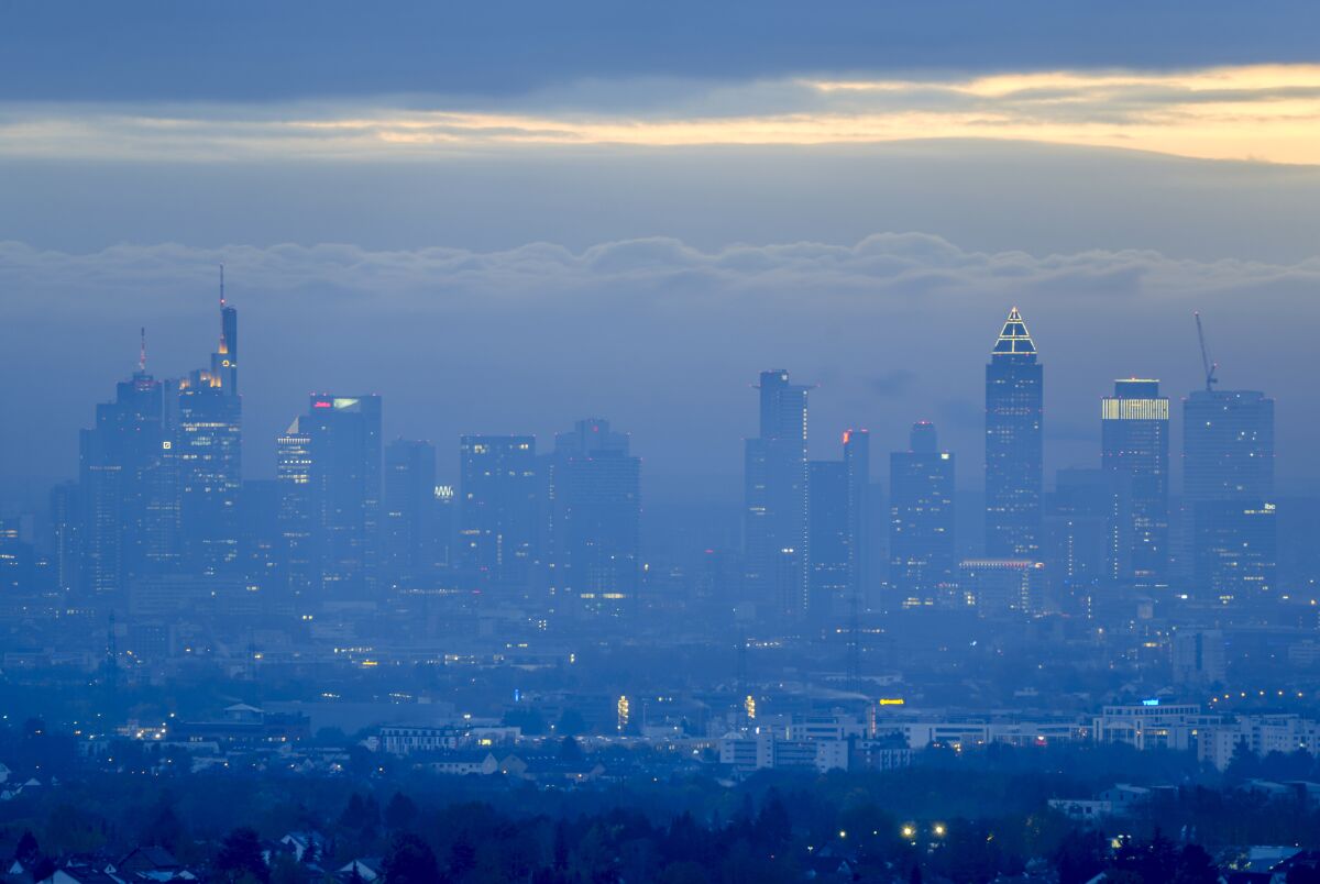 The buildings of the banking district are seen Frankfurt, Germany, on a misty Monday morning, Nov. 8, 2021. (AP Photo/Michael Probst)