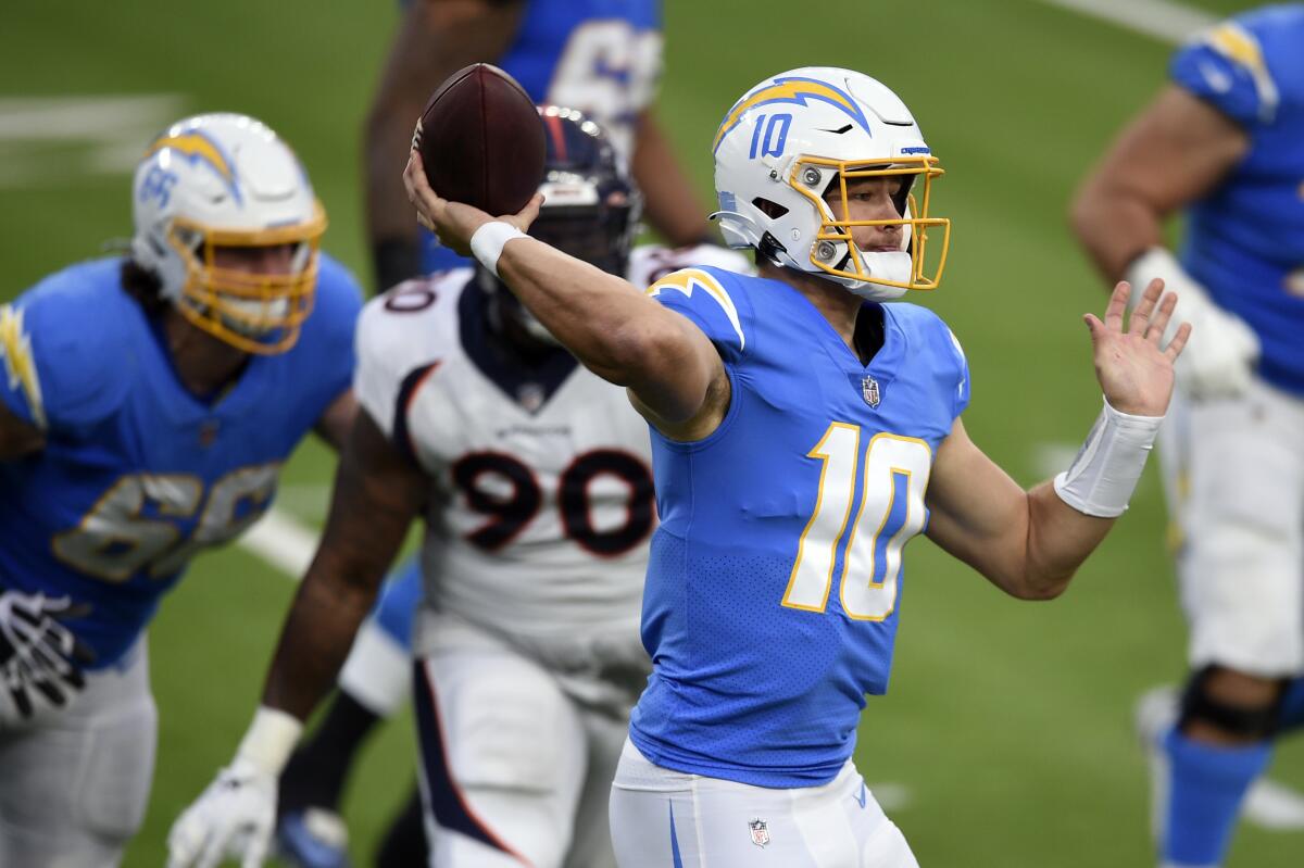 Chargers quarterback Justin Herbert throws against the Denver Broncos.