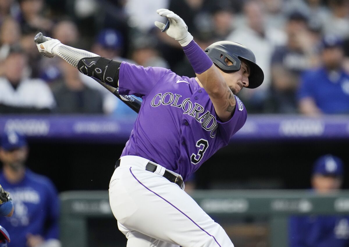 Colorado's Dom Nunez strikes out on a pitch by reliever Tyler Anderson in the fourth inning.